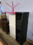 A pink table, three Ikea units and a large cabinet