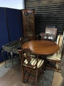 Two metalwork tables, a corner cabinet and a reproduction table with four chairs