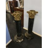 Two black veined marble barley twist pillars (not tops), with brass mounts, 87cm high