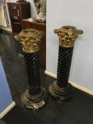Two black veined marble barley twist pillars (not tops), with brass mounts, 87cm high