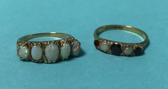 Two 9ct gold opal mounted rings, 5.5 grams