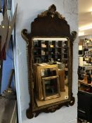 A walnut and gilt framed wall mirror, 79cm x 42cm