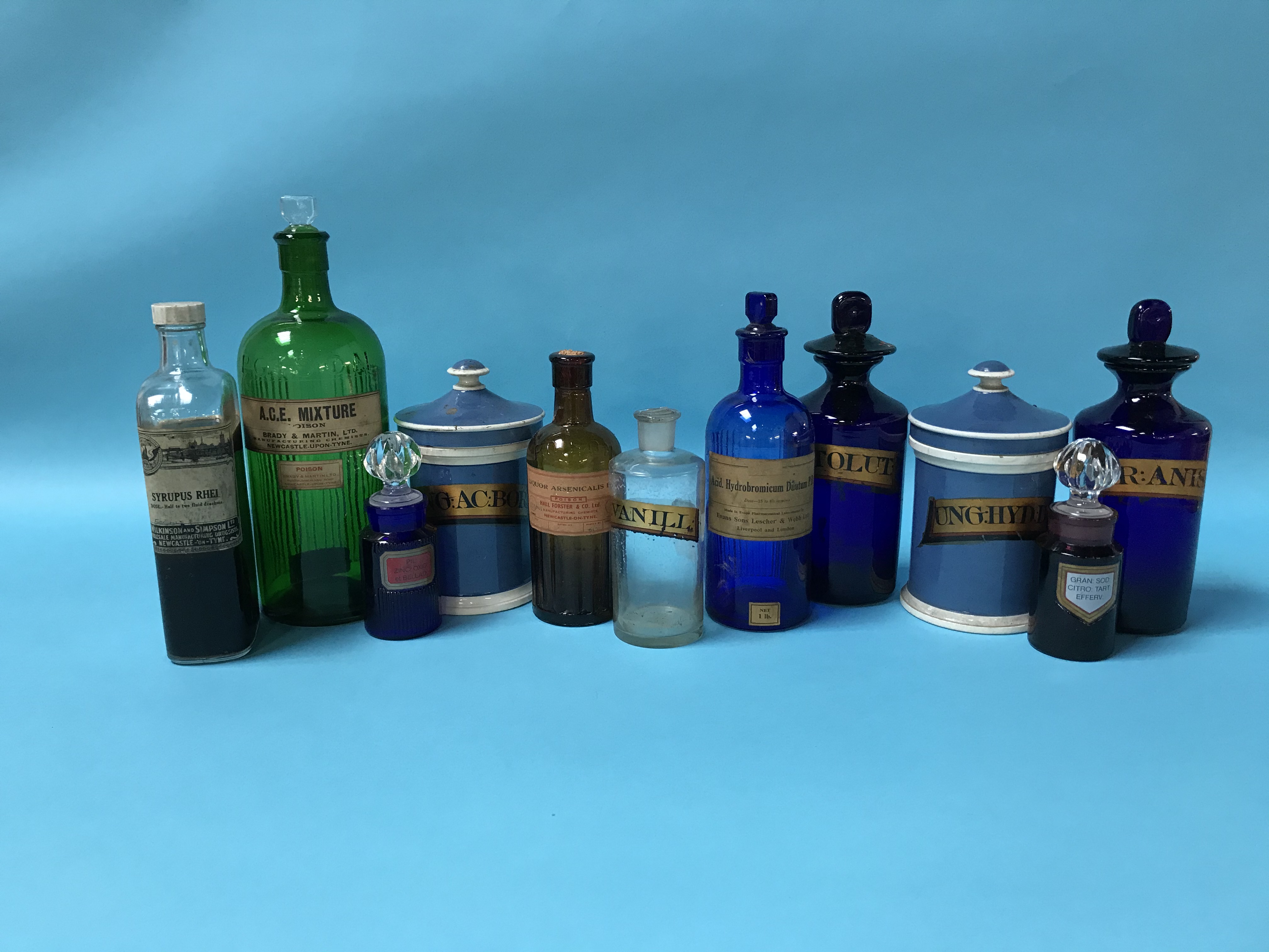 Eleven various glass and pottery Pharmacy bottles