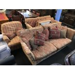 Two settees, an armchair and footstool