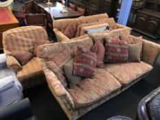 Two settees, an armchair and footstool
