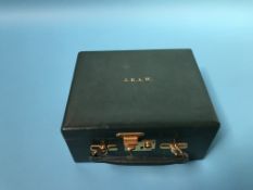 A green leather jewellery box by Asprey of London