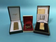 A boxed Dunhill lighter, a Davidoff lighter and one other