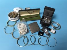 A silver cigarette case and assorted costume jewellery