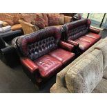 Two oxblood Chesterfield settees