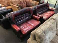 Two oxblood Chesterfield settees