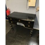 A late 19th century black painted pine five drawer side table