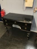 A late 19th century black painted pine five drawer side table