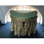 A decorative half moon dressing table