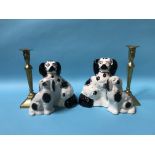 Two pairs of Staffordshire dogs and a pair of brass candlesticks