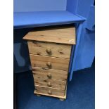 A pine chest of drawers