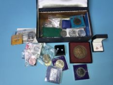 Various coins including silver dollars, a silver ingot etc.