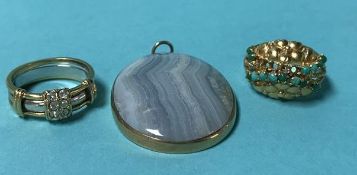 Two unmarked gold coloured rings and a pendant