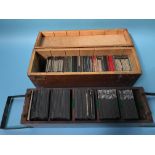 A collection of glass slides, in two fitted boxes