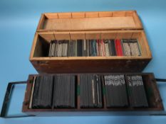A collection of glass slides, in two fitted boxes