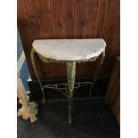 A half moon marble top console table