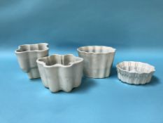 Four pottery jelly moulds