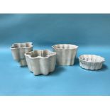 Four pottery jelly moulds