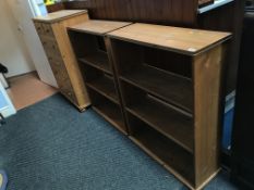 A pine chest of drawers and two pine bookcases