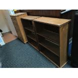 A pine chest of drawers and two pine bookcases