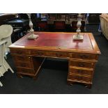 A large yew pedestal desk