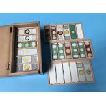 A collection of microscope slides, in fitted box