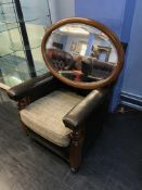 A leather and oak armchair