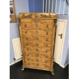 An Empire style walnut chest of eight drawers, 87cm wide