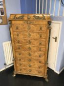 An Empire style walnut chest of eight drawers, 87cm wide