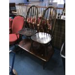 An Ercol coffee table and two chairs