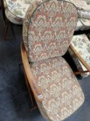 An Ercol armchair and footstool