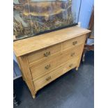 An Edwardian oak chest of drawers