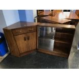 A corner desk and sliding door bookcase