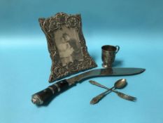 A silver frame, silver cup and kukri etc.