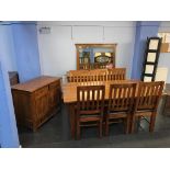 A modern dining room suite, comprising sideboard, cabinet, mirror and a table with six chairs