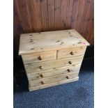 A pine chest of drawers