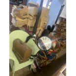 A rocking chair, wall clock and golf clubs etc.