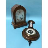 An Edwardian mahogany eight day mantel clock, with strike action, silvered dial and a walnut