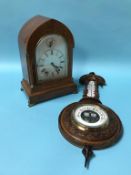 An Edwardian mahogany eight day mantel clock, with strike action, silvered dial and a walnut