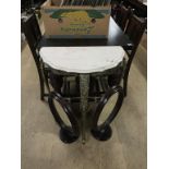 A half moon brass and marble top table