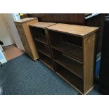 A pine chest of drawers, a box, and a pair of pine bookcases