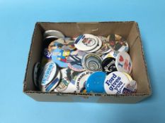 A collection of pin badges