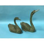 Two decorative brass swans, 26cm high and 35cm high