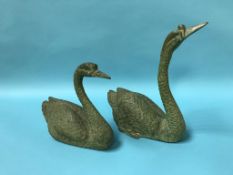 Two decorative brass swans, 26cm high and 35cm high