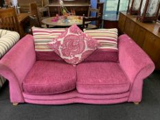 A shocking pink two seater settee