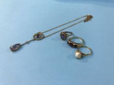 Three 9ct gold rings and a pendant, 14.6g